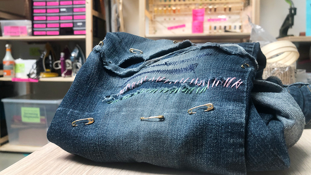 Blue jeans with visible mending
