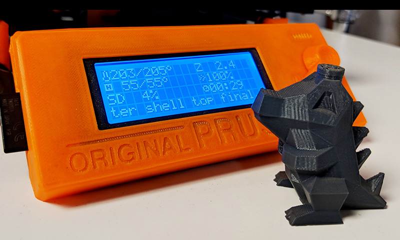 3D Printed lizard and Prusa 3D printer screen.