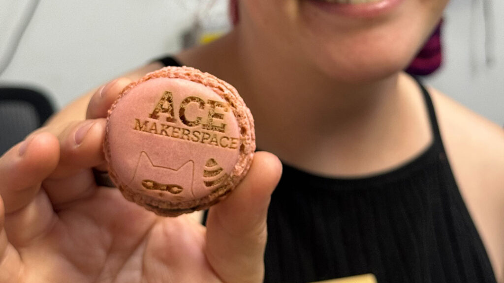 Laser etched pink macaron "Ace Makerspace."